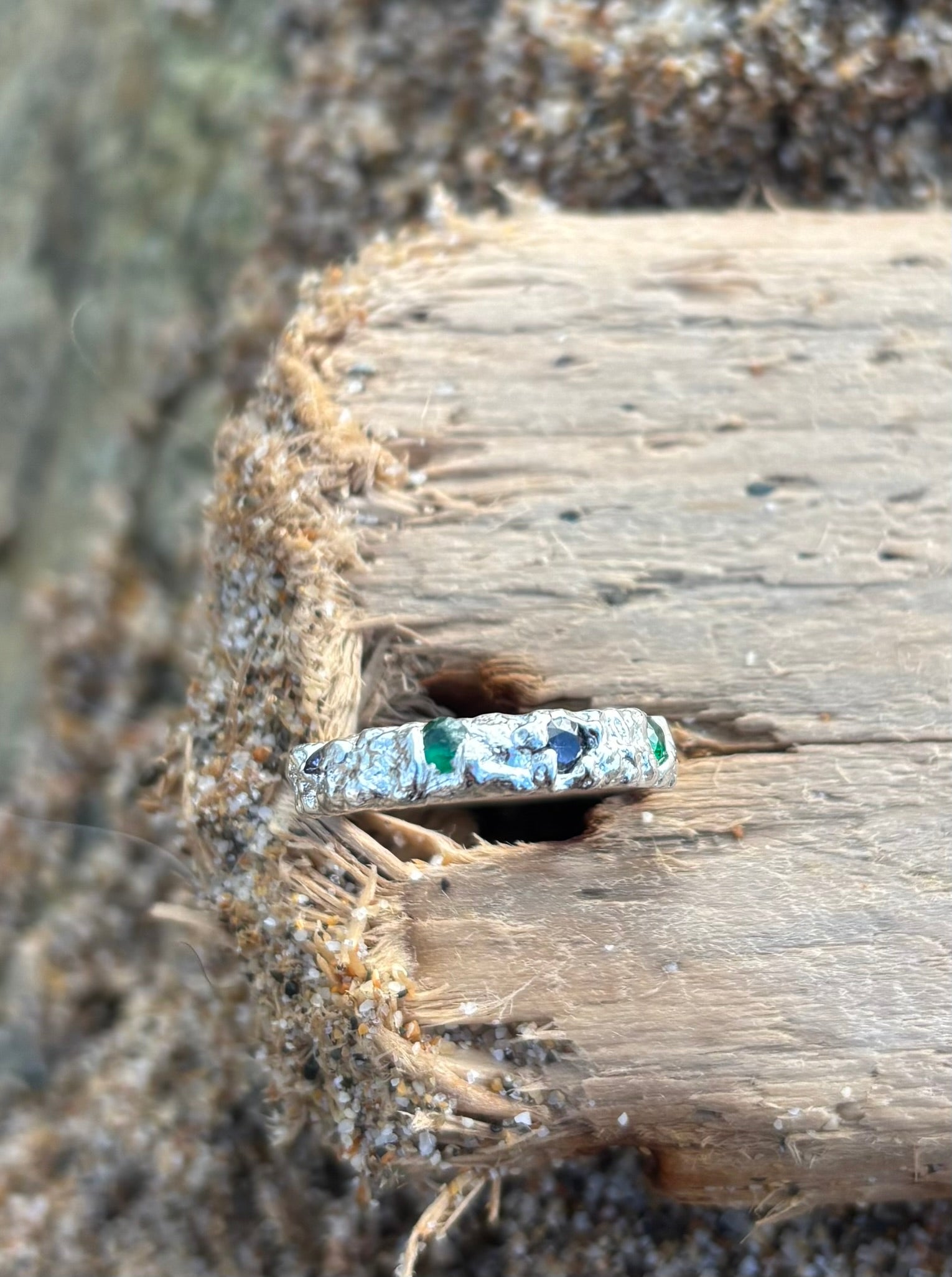 Diamonds in the Ocean, Sterling silver sand cast ring with emerald green and deep blue Zirconia stones