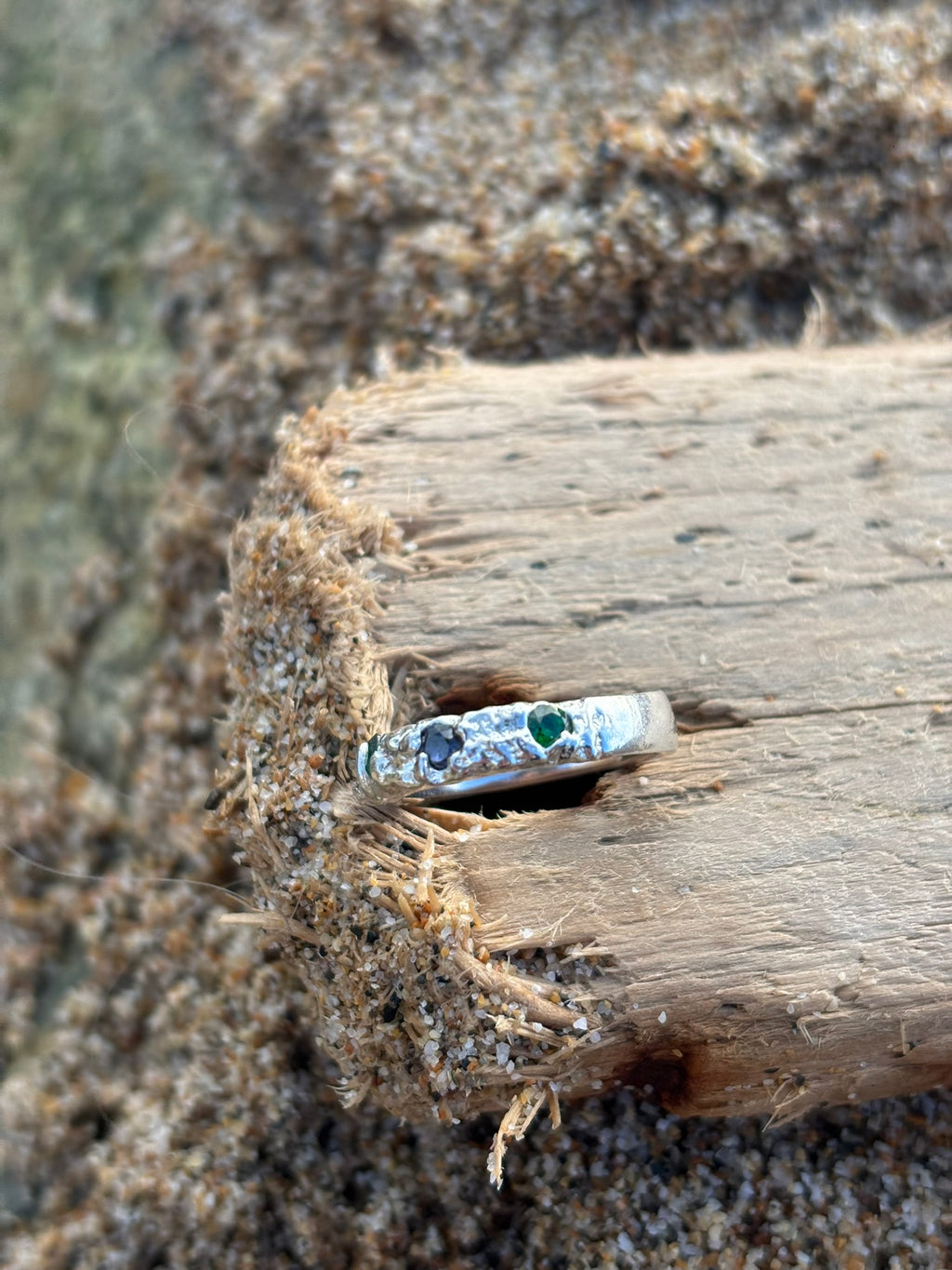 Diamonds in the Ocean, Sterling silver sand cast ring with emerald green and deep blue Zirconia stones