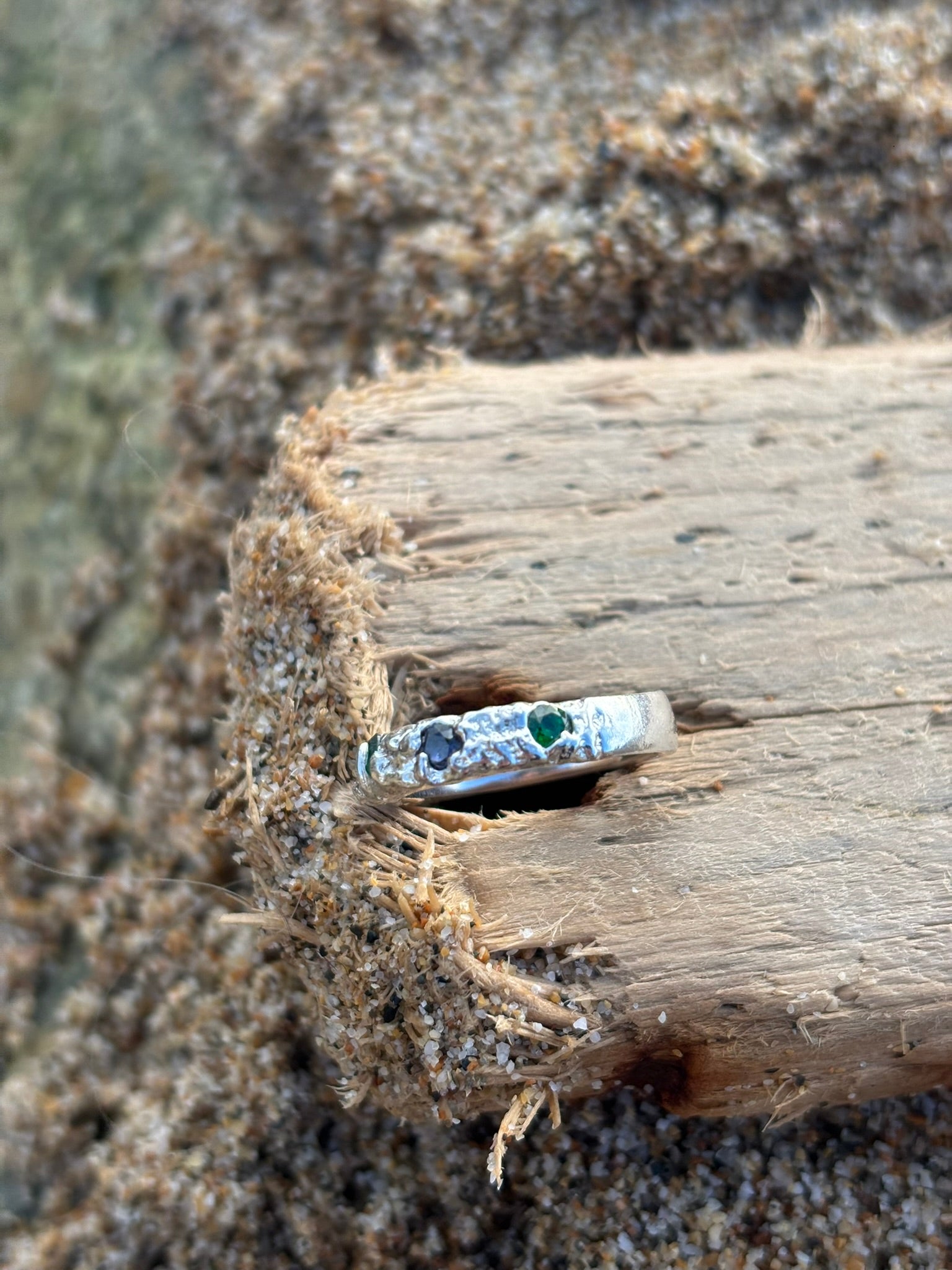Diamonds in the Ocean, Sterling silver sand cast ring with emerald green and deep blue Zirconia stones