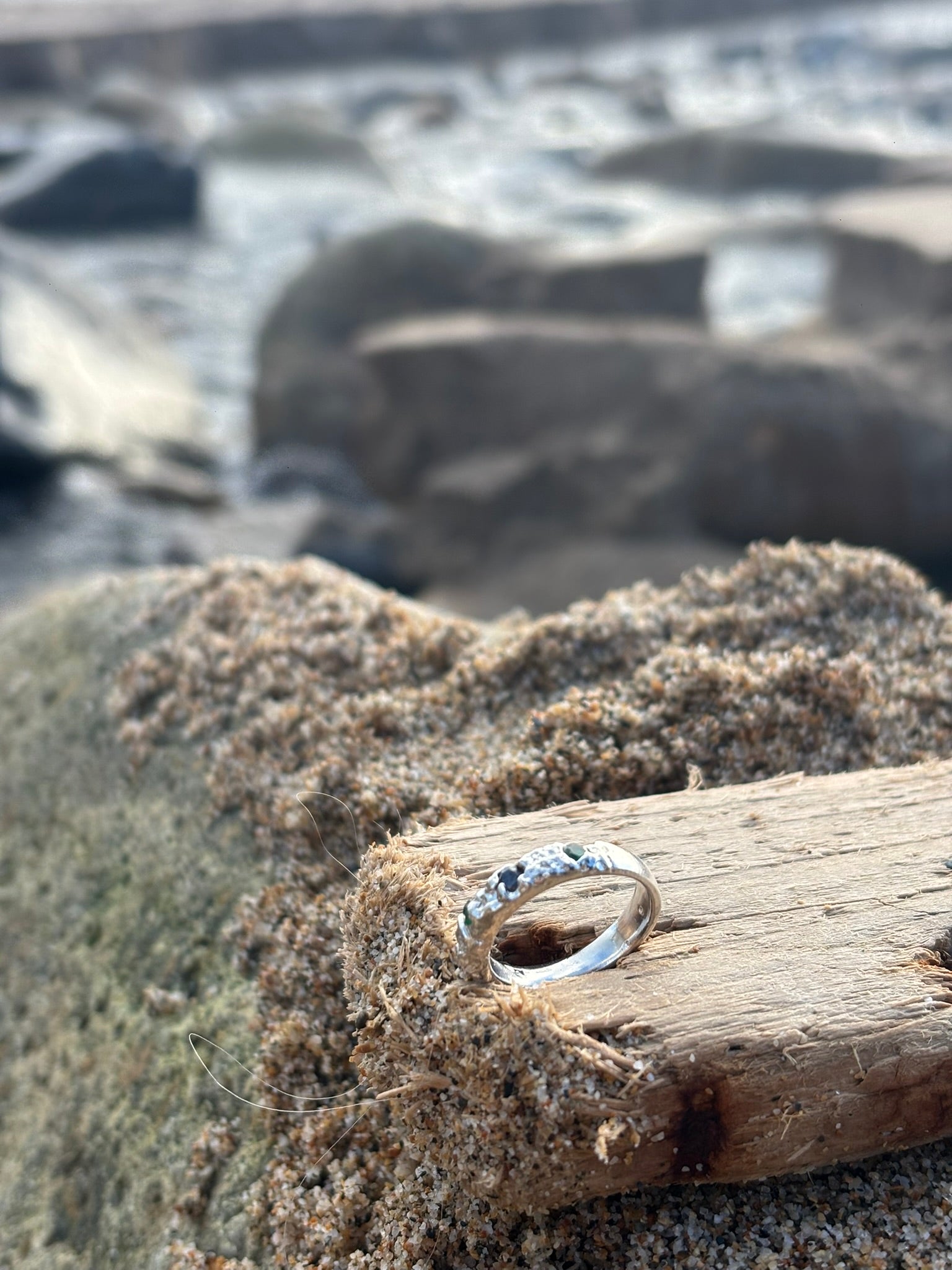 Diamonds in the Ocean, Sterling silver sand cast ring with emerald green and deep blue Zirconia stones